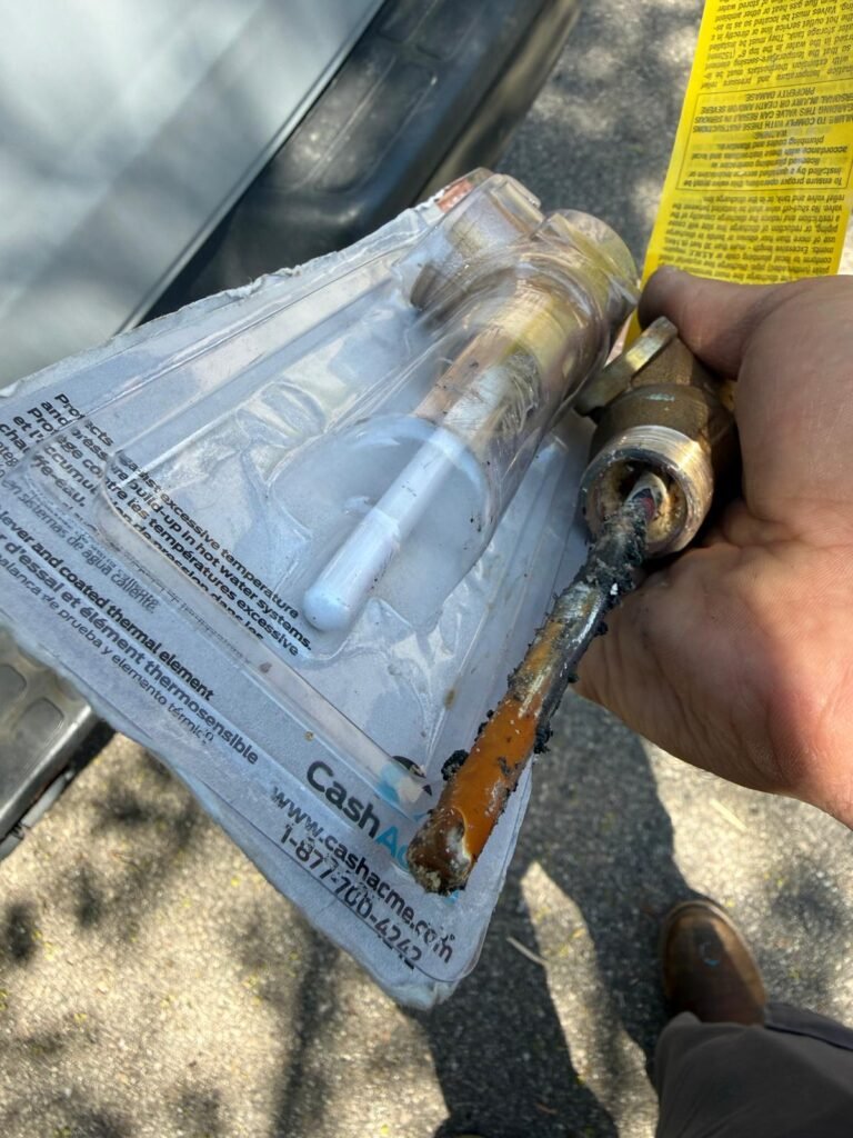 Sediment buildup inside a water heater relief valve causing it to not close fully and leak.. before and after pics2