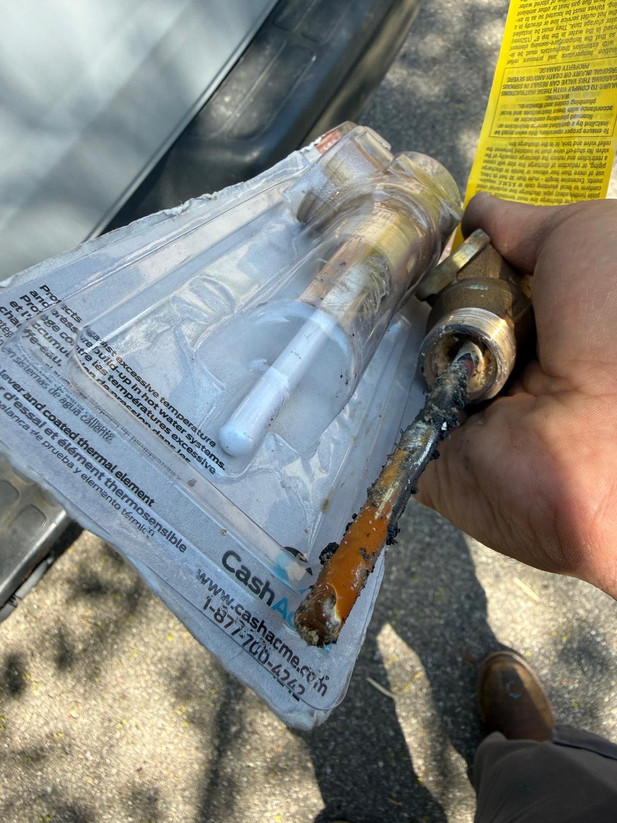 Sediment buildup inside a water heater relief valve causing it to not close fully and leak.. before and after pics2